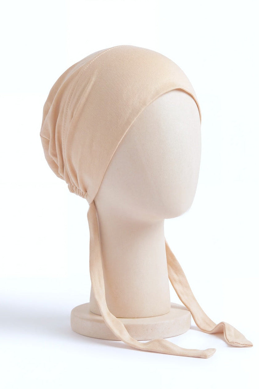 Cream tie back hijab under cap, second view
