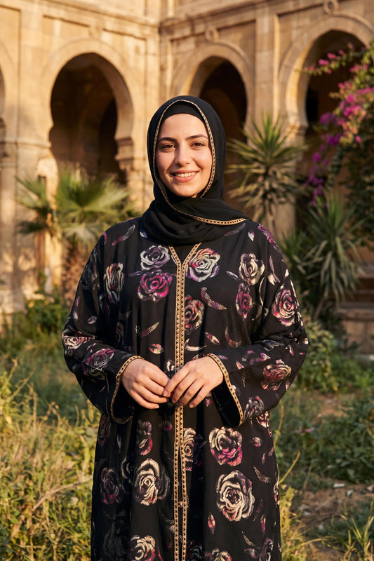 Rosette abaya in Orchid, black Korean Nida abaya with floral design and gold trim, with matching hijab