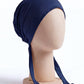 Navy tie back hijab under cap, second view