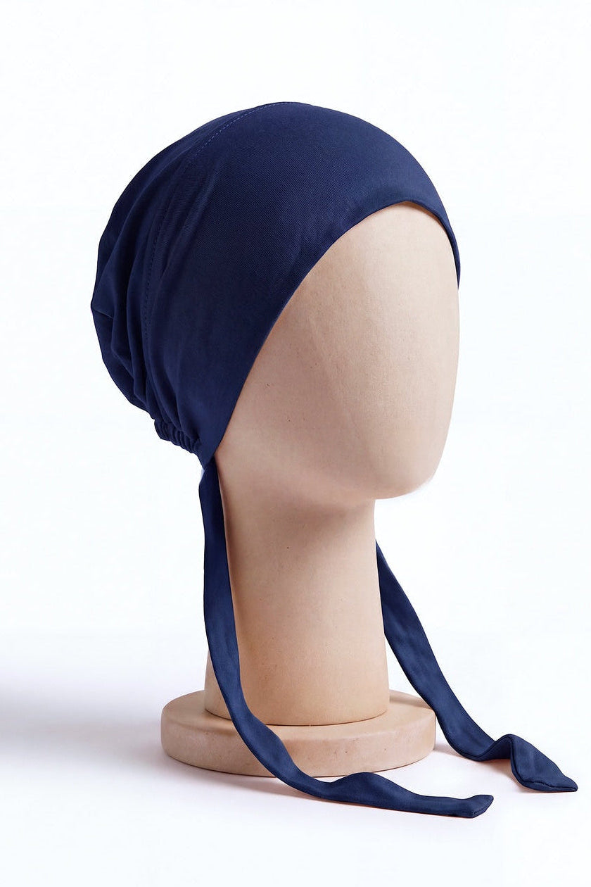 Navy tie back hijab under cap, second view