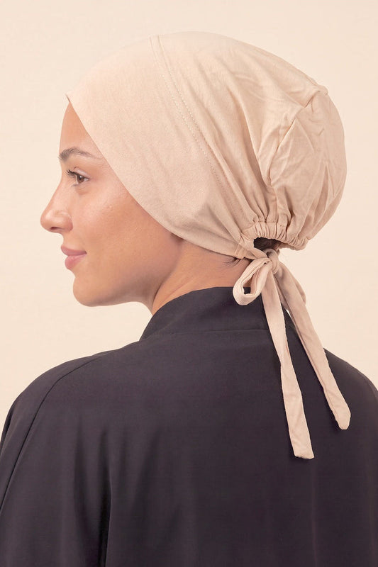 Cream tie back hijab under cap