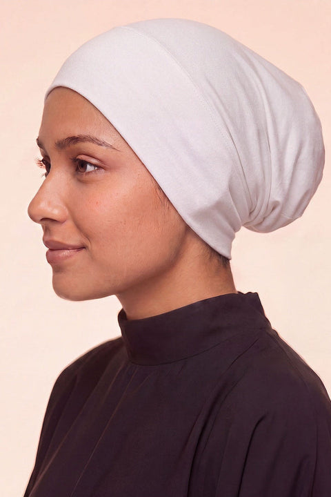 White tube hijab under cap