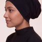 Black tube hijab under cap