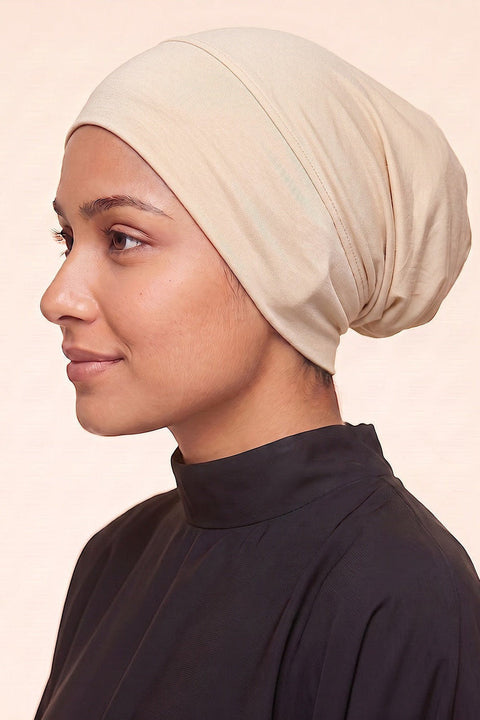 Cream tube hijab under cap
